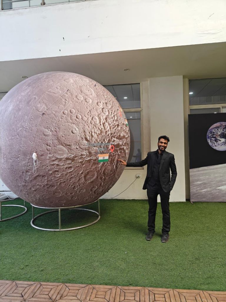 At the ISRO NRSC campus, beside the Chandrayaan moon model